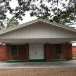 The first facility was a wooden building located not far from the present building. This 2-story structure was used until it burned in later years. The second building was erected across the road from where the present structure is located. It was a small box house with 12-inch vertical planks. In 1900, the congregation under the leadership of Pastor Joseph Rudicille, appointed a committee of three men to buy land for a cemetery. In 1969, the current brick structure was built beside the cemetery.