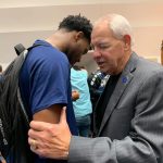 A Louisiana College staff member prayed with students at the close of the first day of the campus revival.