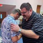 A Louisiana College staff member prayed with students at the close of the first day of the campus revival. Seven students made a decision to follow Christ during the three-day revival, September 17-19.