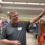 An E4 Preaching Conference participants raises his hands during a time of worship at the First Baptist Church in Pineville.