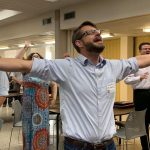 An E4 Preaching Conference participants raises his hands during a time of worship at the First Baptist Church in Pineville.