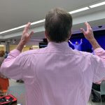 An E4 Preaching Conference participants raises his hands during a time of worship at the First Baptist Church in Pineville.