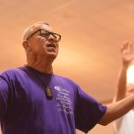 An inmate at the Louisiana State Penitentiary at Angola lifted his hands toward heaven during a time of worship at a revival on the prison grounds September 19.