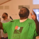 An inmate at the Louisiana State Penitentiary at Angola lifted his hands toward heaven during a time of worship at a revival on the prison grounds September 19.