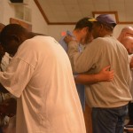 An inmate at the Louisiana State Penitentiary at Angola lifted his hands toward heaven during a time of worship at a revival on the prison grounds September 19.