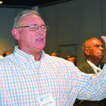 Thumper Miller, pastor of the First Baptist Church in Mansfield, lifted his hands in praise during a time of worship at the Louisiana Baptist Convention Executive Board meeting.