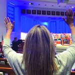 An attendee to the 2019 annual Pastors Conference raises her hands in worship at the opening of the event, which took place First Baptist Church, Pineville on November 10 and 11.