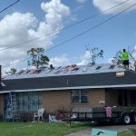 Volunteers tarp a roof damaged in the Lake Charles area. Submitted photo/Taken Sept. 2.
