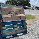 A sign directed motorists to come pick up supplies at First Baptist Church in Moss Bluff. Brian Blackwell photo/Taken Sept. 2.