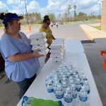 A woman picked up boxed meals served a member of First Baptist Church in Moss Bluff. Brian Blackwell photo/Taken Sept. 2.