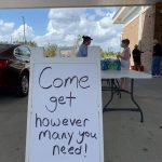 A sign welcomed motorists to pick up meals at First Baptist Church in Moss Bluff. Brian Blackwell photo/Taken Sept. 2.