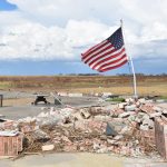 Amid the rubble, an American flag flew high above and signaled a hope for the community of Cameron. Norm Miller photo/Taken Sept. 12.