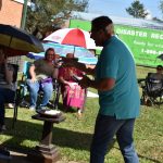 With sweat rolling down his back and face in the 100+ degree heat index, Pastor Bobby Daniel poured out his heart and he preached from Isaiah 41:10 during the first worship service after Hurricane Laura for First Baptist Church in Vinton. Norm Miller photo/Taken Sept. 13.