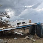 Hurricane Laura placed a car sideways and underneath debris in Cameron. Norm Miller photo/Taken Sept. 13.