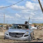 A damaged car sat among debris near Holly Beach. Norm Miller photo/Taken Sept. 13.