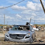 A damaged car sat among debris near Holly Beach. Norm Miller photo/Taken Sept. 13.