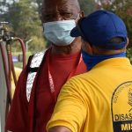 Missouri Baptist Disaster Relief Blue Hat Edgar Barnhill spoke with an American Red Cross worker at First Baptist Church in DeRidder. Philip Timothy photo/taken Sept. 3.