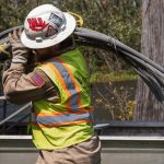 An Entergy lineman carried materials to repair lines damaged by Hurricane Laura. Entergy photo/Aug. 30.