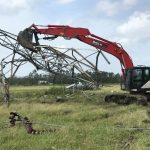 An excavator worked with Cleco crews to clear damage in Sulphur. Brian Blackwell photo/Taken Sept. 2.