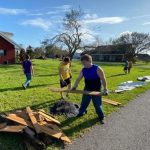 An LSU BCM member moved debris to the street that was scattered across the home of fellow member Taylor Moses. Steve Masters photo/Taken Aug. 30.