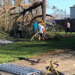 LSU BCM members move debris from the home of Taylor Moses in Longville. Moses is a member of the BCM. Steve Masters photo/Taken Aug. 30.