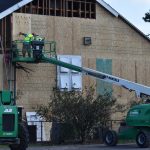 Crews repair a wall that was damaged at Maplewood First Baptist Church in Sulphur. Brian Blackwell photo/Sept. 3.