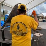 An Oklahoma Baptist Disaster Relief team member stirred green beans served at the noontime meal to motorists at First Baptist Church in Moss Bluff. Brian Blackwell photo/Taken Sept. 3