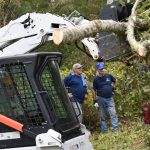 South Carolina Baptist Disaster Relief team members look on a Bobcat was used to remove debris that fell near the parsonage at Simpson Baptist Church in Simpson. Brian Blackwell photo/Taken Sept. 1.