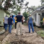 A Southern Baptist Disaster Relief team discussed the work they would soon perform on a home in Alexandria. Haleigh Lachney photo/Taken Sept. 30.