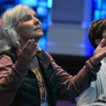 Kathy Douglass, a member of Cheniere Baptist Church, West Monroe, enjoys a time of worship at the Embrace women's conference.