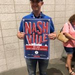 Jay Avance, pastor of East Fork Baptist Church, Kentwood, poses with an SBC Annual Meeting poster.