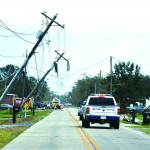 Ida's winds snapped and bent over these poles near Houma. Baptist Message photo