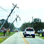 Ida's winds snapped and bent over these poles near Houma. Baptist Message photo