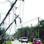 Ida's winds snapped and bent over these poles near Houma. Baptist Message photo