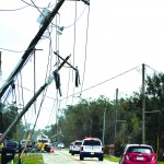 Ida's winds snapped and bent over these poles near Houma. Baptist Message photo