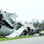A pile of debris filled the middle of a highway near Golden Meadow. Baptist Message photo