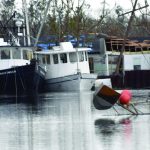 Boats in Golden Meadow were tossed around by Ida's winds. Baptist Message photo