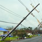 Ida's high winds tipped over this line of poles. Baptist Message photo