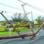 Ida's high winds tipped over this line of poles. Baptist Message photo