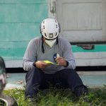 A FEMA worker looks over information during a damage assessment in an area impacted by Hurricane Ida. FEMA photo