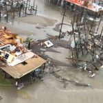 Floodwaters and sand engulfed roadways in Grand Isle. Louisiana Governor's Office of Homeland Security and Emergency Preparedness