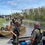 Louisiana Department of Wildlife and Fisheries agents prepared to take off in a boat that traveled through flooded streets. LDWF photo