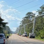 CLECO trucks worked to restore electricity in Madisonville shortly after Hurricane Ida passed through. CLECO photo