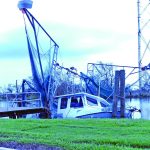 A boat sustained heavy damage in this bayou. Baptist Message photo