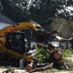 Members of the 202nd Rapid Engineer Deployable Heavy Operational Repair Squadron Engineers (Red Horse) partnered with the 159th Civil Engineering Squadron and New Orleans Parks and Parkways to clear debris from roadways in New Orleans. Red Horse, from Camp Blanding, Fla., is a specialized, highly mobile civil engineering team comprised of Florida Army and Air National Guardsmen that provides rapid response capabilities for multiple worldwide contingencies and operations. U.S. Air Force Capt. Larissa Lambert photo