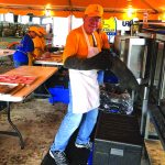 An Arizona Baptist Disaster Relief feeding team member helps prepare meals for those impacted by Hurricane Ida.