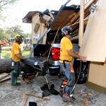 Arkansas Baptist Disaster Relief team members moved debris near Hammond. Patrick Dennis photo