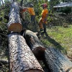 Arkansas Baptist Disaster Relief team members move debris in Hammond. Patrick Dennis photo