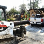 An Arkansas Baptist Disaster Relief team member moved debris near Hammond. Patrick Dennis photo