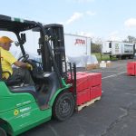 An Arkansas Baptist Disaster Relief team member moved supplies at Woodland Park Baptist Church in Hammond. Patrick Dennis photo